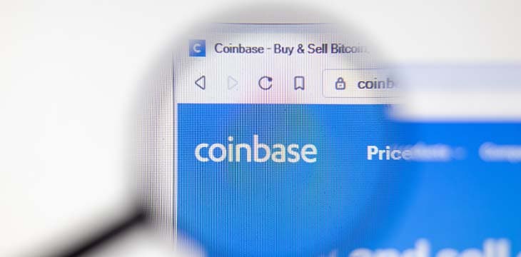 Coinbase on a desktop in a magnifying glass